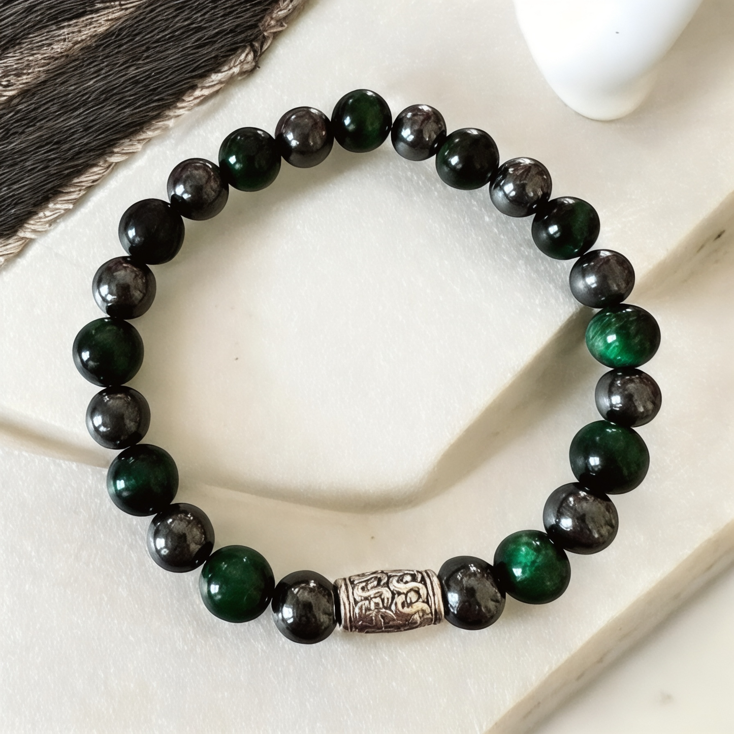 Handmade men’s bracelet with deep green tiger eye and black-silver hematite beads, accented by an engraved silver-tone barrel 